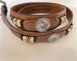 A large collection of hand tooled Leather, alligator lizard belts from many Designers.  https://www.liveauctioneers.com/catalog/274244