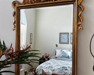Gilt Mirror adorned with gilt bow