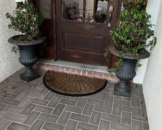 Pair of large cast iron Urns with Ivy Topiaries