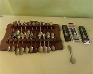 Souvenir spoon collection in wooden display