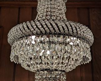 One of a pair of 3-light crystal chandeliers available.