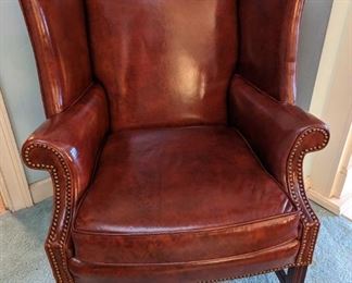Vintage leather wingback chair, with brass nailhead trim, by Classic Leather Inc., Hickory, NC.