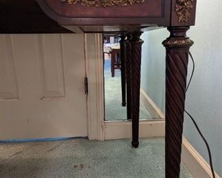 Leg and bronze mount details of the antique desk.