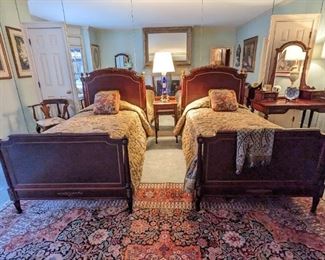 Stunning antique bedroom suite, from the 94-years-old owner's grandparents, who bought it in Pennsylvania 90 years ago. The suite includes a pair of twin beds, a desk with six drawers, and beveled glass mirror and a 9-drawer chest with marble top and beveled glass mirror. The bronze mounts are crisp and all the hardware is original - an amazing set to see in person!