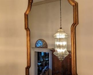 Vintage 1980's gold-framed wooden wall mirror, as you climb the winding staircase tot he second floor.