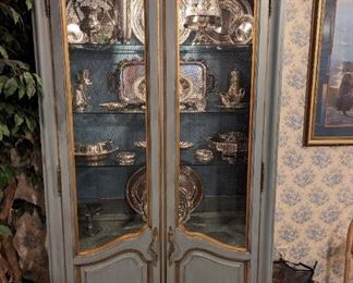 Wonderful, French-inspired vintage Karges Furniture Co. (Evansville, IN) lighted china cabinet, with glass shelves and chicken wire door fronts.