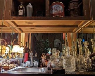 Nice collection of vintage Irish cut crystal decanters, ice buckets and other barware paraphernalia.