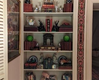 One of three bookcases in the living room, filled with good books and collection of vintage doodads and cast iron toys.