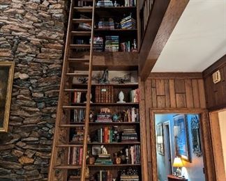 OK! Now we're talkin'! When's the last time you saw a 20' tall bookcase FILLED with books and collectible shiny things that you cannot possibly live another day without?!? Life-threatening library ladder not for sale.