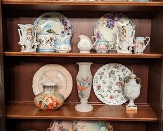 Vintage Karges Furniture Co., china cabinet, filled with antique, hand-painted porcelains.