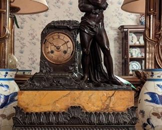 Close-up pic of the antique French bronze God/marble mantle clock.