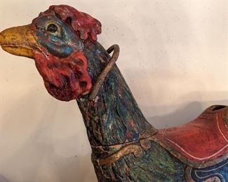Here's the pecker on the 19th century, hand-carved/painted carousel rooster.