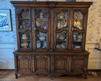 French provincial Karges Furniture china cabinet, with four doors with glass/metal fronts, pacific cloth-lined flatware storage below.