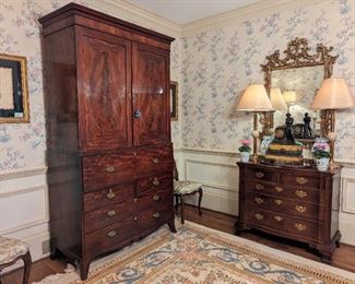 Antique English drop-front secretary and linen press, vintage wooden wall mirror, Henredon 5-drawer Chinese Chippendale chest, pair of custom-made (Paul Smith) table lamps and antique French bronze & marble mantle clock.