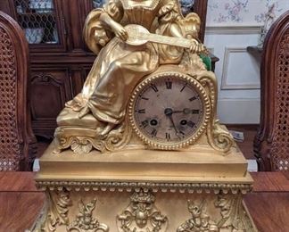 Close-up of the gold gilt bronze French mantle clock.