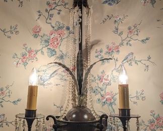 One of a pair of 2-light, custom-made wall sconces, with hand-hammered bronze leaves, glass beads and drop crystals.