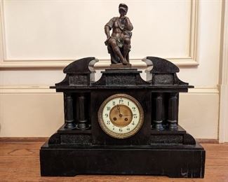Monumental antique black slate and bronze Italian clock, measuring 1' 21" long x 1' 23" to the top of the bronze figure. The bronze figure atop this clock is Lorenzo de Medici - "Banker, de facto ruler of the Florentine Republic and the most powerful and enthusiastic patron of Renaissance culture in Italy . Also known as 'Lorenzo the Magnificent' by Contemporary Florentines, he was a magnate, diplomat, politician and patron of scholars, artists and poets".