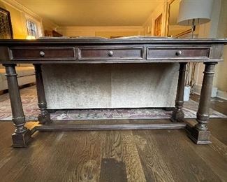 South Cone Trading Company Peruvian Wood Three-Drawer Console Table With Distressed Leatherette Top. Measures 68" W x  20 1/4" D x 30 1/2" H. Photo 1 of 4. 