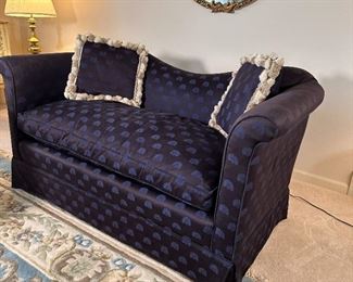 Blue loveseat with down cushions