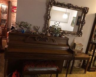Kimball Spinet Upright Piano, Ornate Mirror, On Piano Top: Jade/Stone Plants, Porcelain Flowers, Lighthouse Replicas, Porcelain Eagle Figurine, Glass Blue Bird of Happiness. (See next photos for close up)
