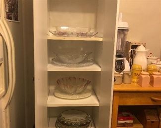 3rd storage cabinet.  Glassware Serving Platters and Bowls.