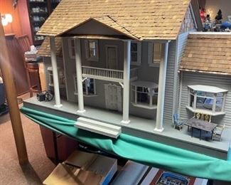 custom doll house complete with hardwood plank floors and wallpaper 