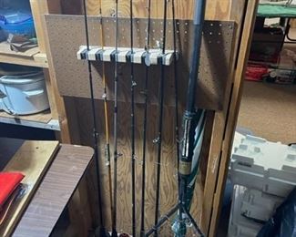 many fishing poles and lures 