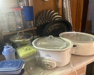 Large selection of crockpots, Nesco cookers, and pressure cookers 