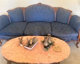 Formal sofa; oval coffee table