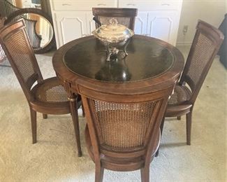 Dining/game table and 4 chairs (cane seats and backs)