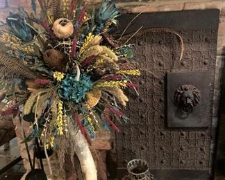 One of two "Horn vase" arrangement; one of two lion head panels