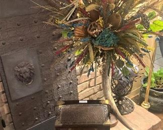 Two of two "Horn vase" arrangement; two of two lion head panels