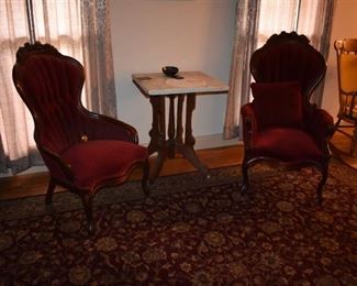 Gorgeous Antique Victorian Red Chairs surrounding an Antique Marble top Table with Victorian Base and white porcelain wheels