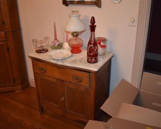 Antique Marble Top Dry Sink adorned with many collectibles including this Beautiful Cranberry Cut Bohemian Decanter