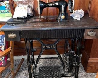 Vintage "Anker" sewing maching in cabinet with cast iron base (1920's)