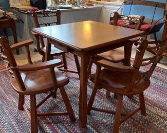 Game table with pad and horsey design chairs