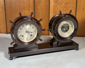 TIFFANY & CO. SHIPS BELL CLOCK  |                              Tiffany & Co., metal Chelsea style "ships bell" yacht wheel clock and barometer, likely bronze - l. 14 x w. 3 x h. 9 in.