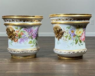 (2pc) PAIR GILT PAINTED JARDINIERES  |                                Each decorated with hand painted blooming flowers and vines with gilt highlights, and outset handles in the form of a female face - h. 15 x dia. 14.5 in.