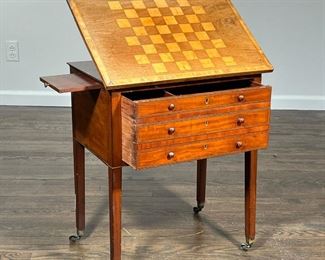 GAME SIDE TABLE  |                                                              Wood side table with an inlaid chess board on the top surface over a single deep storage drawer with false drawer fronts, side slide out, adjustable tilt top; all over four legs on casters - l. 14 x w. 22 x h. 25 in.