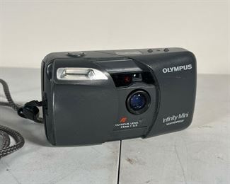 OLYMPUS INFINITY MINI  |   Olympus Infinity Mini Weatherproof 35mm point and shoot camera; film loaded in camera - l. 5 x w. 2 in.