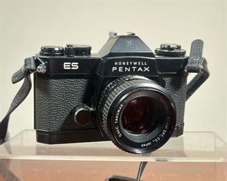 HONEYWELL PENTAX ES CAMERA  |   Vintage Honeywell Pentax ES 35mm analog film camera with SMC Takumar 1.8 55mm lens with original manual and leather carrying case, also includes Soligor 19A flash - l. 10 x w. 5 x h. 8 in. (case measurement)