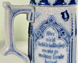 (4pc) METTLACH STEINS  |  Four blue and grey stoneware Mettlach steins from Germany, with pewter lids (one missing); depicting drinking scenes, horse scenes, and castle scenes - h. 8 x dia. 4.5 in. (1L stein)