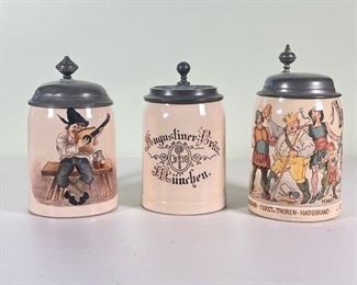 (3pc) 0.5L GERMAN STEINS  |  A set of three half liter German steins, each with lids and signed / marked on bottom (one marked Villeroy & Boch) - h. 7 x dia. 4 in.
