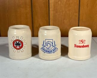 (3pc) VINTAGE BEER MUGS  |  Three ceramic European .5 L beer mugs; Gruibinger Bier, AFRC Garmisch Ski Austria, and Kronenbourg - w. 5 x h. 6 in.
