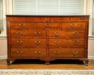 UNUSUAL LIFT TOP SIDEBOARD  |  Inlaid in contrasting woods, reeded corners on bracket feet; having a full with lift top over three false drawer fronts over two banks of three drawers - l. 70 x w. 22 x h. 43 in.
