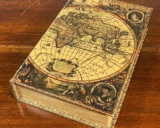 BOOK SAFE  |  The outside bound with a map, lifting to reveal a soft lined interior, no apparent maker - l. 12.25 x w. 8.25 x h. 2.75 in.
