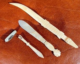 (4pc) DECORATIVE KNIVES  |  One mother of pearl mini multi tool; three letter openers: two are carved mother of pearl and one carved bone in the shape of an alligator - l. 9 in. (alligator)