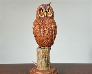 "BUD K" CARVED OWL  |  With matching stand, signed on the bottom; owl h. 8.5 in - overall l. 8 x w. 6 x h. 13.5 in.