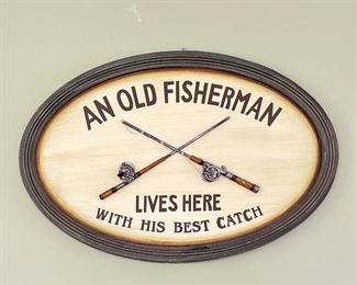 FISHERMAN WALL DECOR  |  Very punny oval sign with crossed fishing rods that reads "An Old Fisherman Lives Here with His Best Catch" - w. 24 x h. 16 in.
