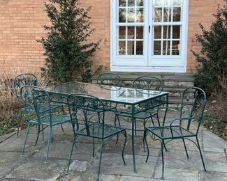 (7pc) ASSEMBLED PATIO FURNITURE SUITE  |  Outdoor dining table and chairs, not a matching set but of similar designs, including a rectangular table with a glass top, three side chairs, and one arm chair with matching pattern and one side chair, and one arm chair with similar pattern - l. 60 x w. 30 x h. 29 in. (table)